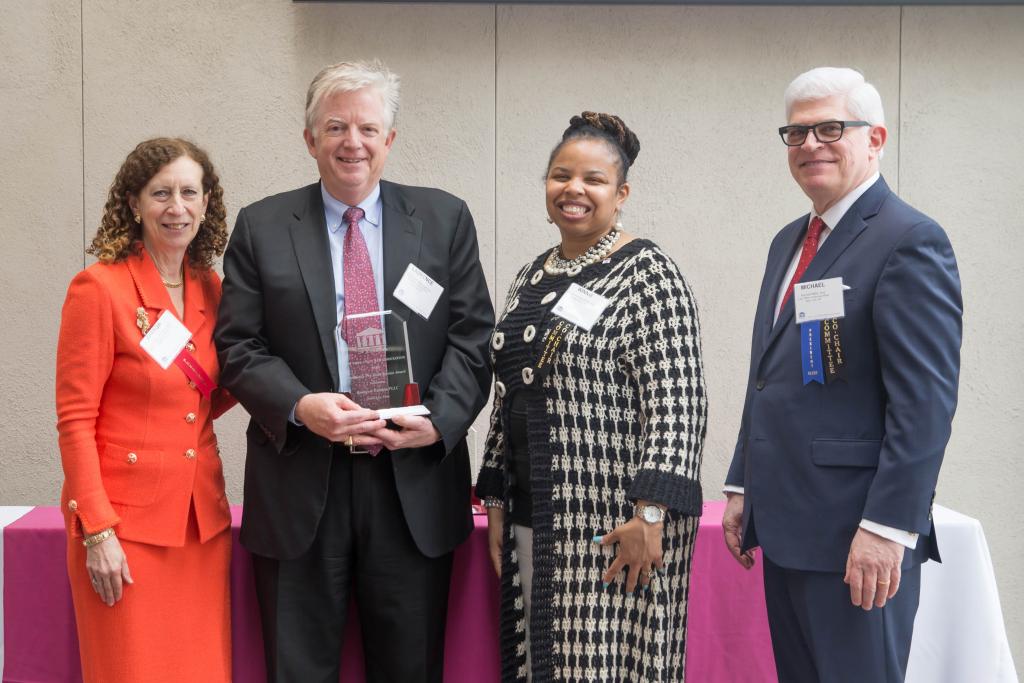 Laurence Bousquet accepts the President's Pro Bono Service Award from the New York State Bar Association. 