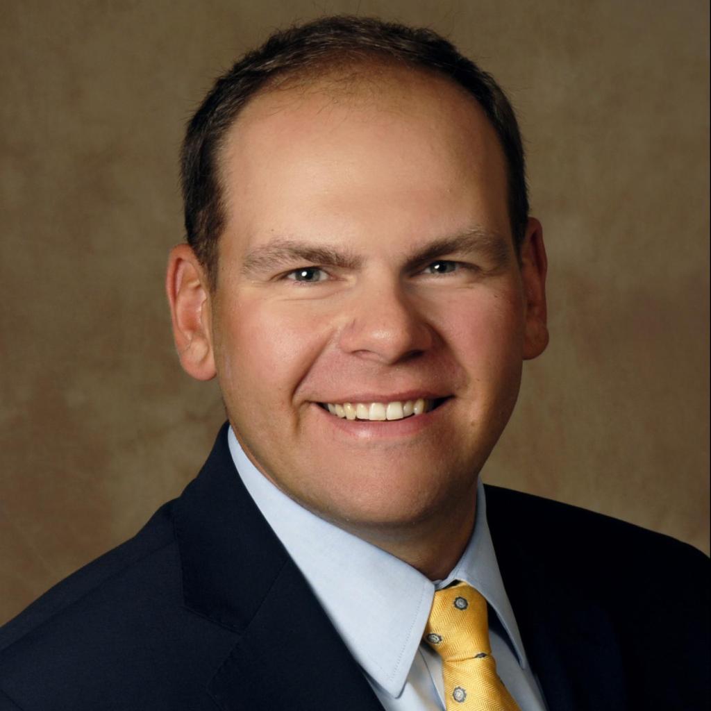 Brownfields attorney Michael Tyszko smiles for his studio headshot.