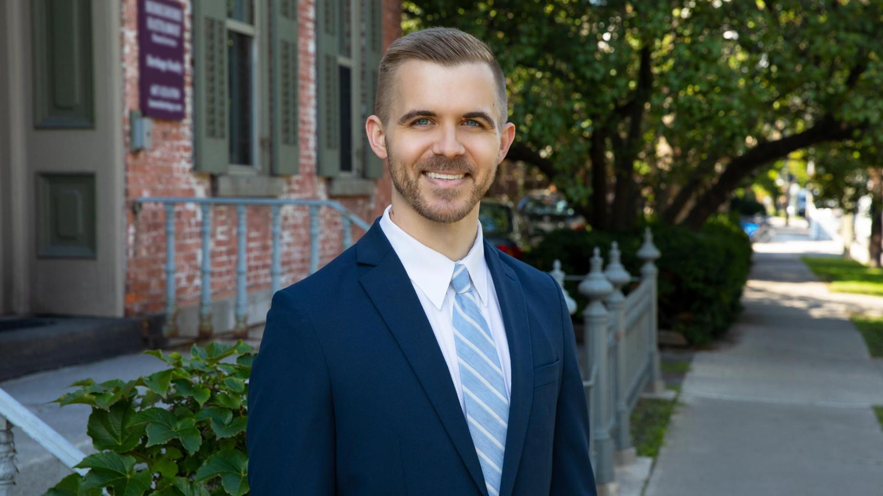 Trusts and estate attorney Robert Kawecki smiles for his Bousquet Holstein attorney photo in Ithaca.