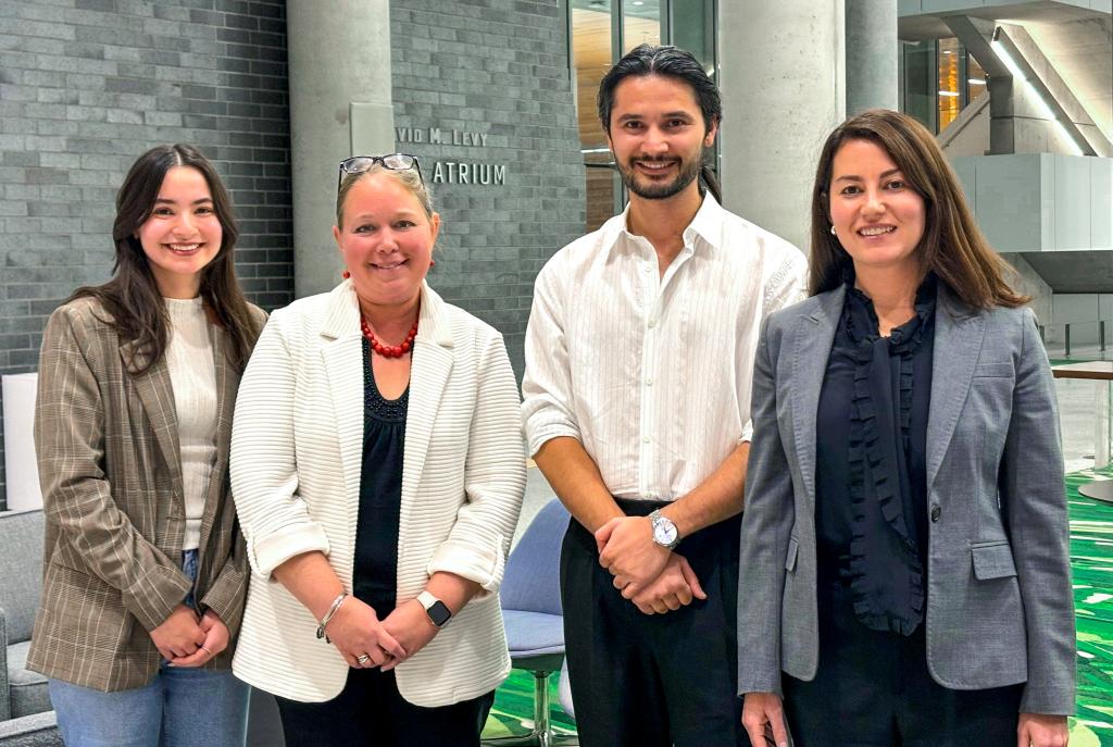 Bousquet Holstein immigration attorney Rebecca Cohen pictured with her pro bono client Naveed and Sara McDowell from the Volunteer Lawyers Project. 