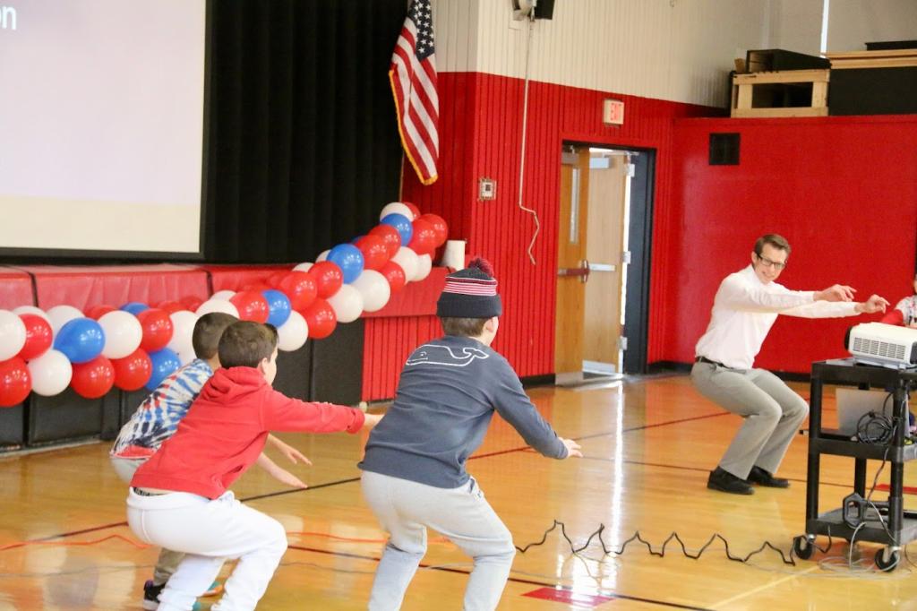 Litigation attorney Nathan Jerauld, a U.S. Army Veteran, demonstrates a physical training exercise using Army cadence. 